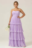 Vestido de dama de honor largo de talla más largo y filetes sin tirantes lila plisados en A-Line