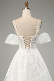 Vestido de novia de tirantes finos de tul de línea A marfil con apliques