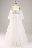 Vestido de novia de tul con hombros descubiertos y apliques