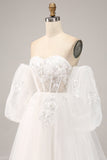 Vestido de novia de tul con hombros descubiertos y apliques