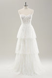 Vestido de novia largo con corsé sin tirantes blanco escalonado