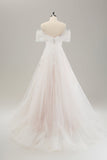 Vestido de novia de tul blanco con hombros descubiertos con bordados